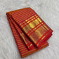Yellow Vairaoosi pure silk Kanchipuram saree with fine zari stripes, decorative buttas and contrast border.