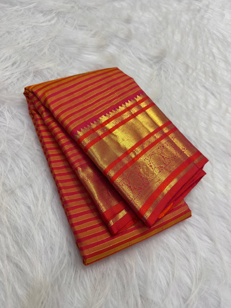 Yellow Vairaoosi pure silk Kanchipuram saree with fine zari stripes, decorative buttas and contrast border.