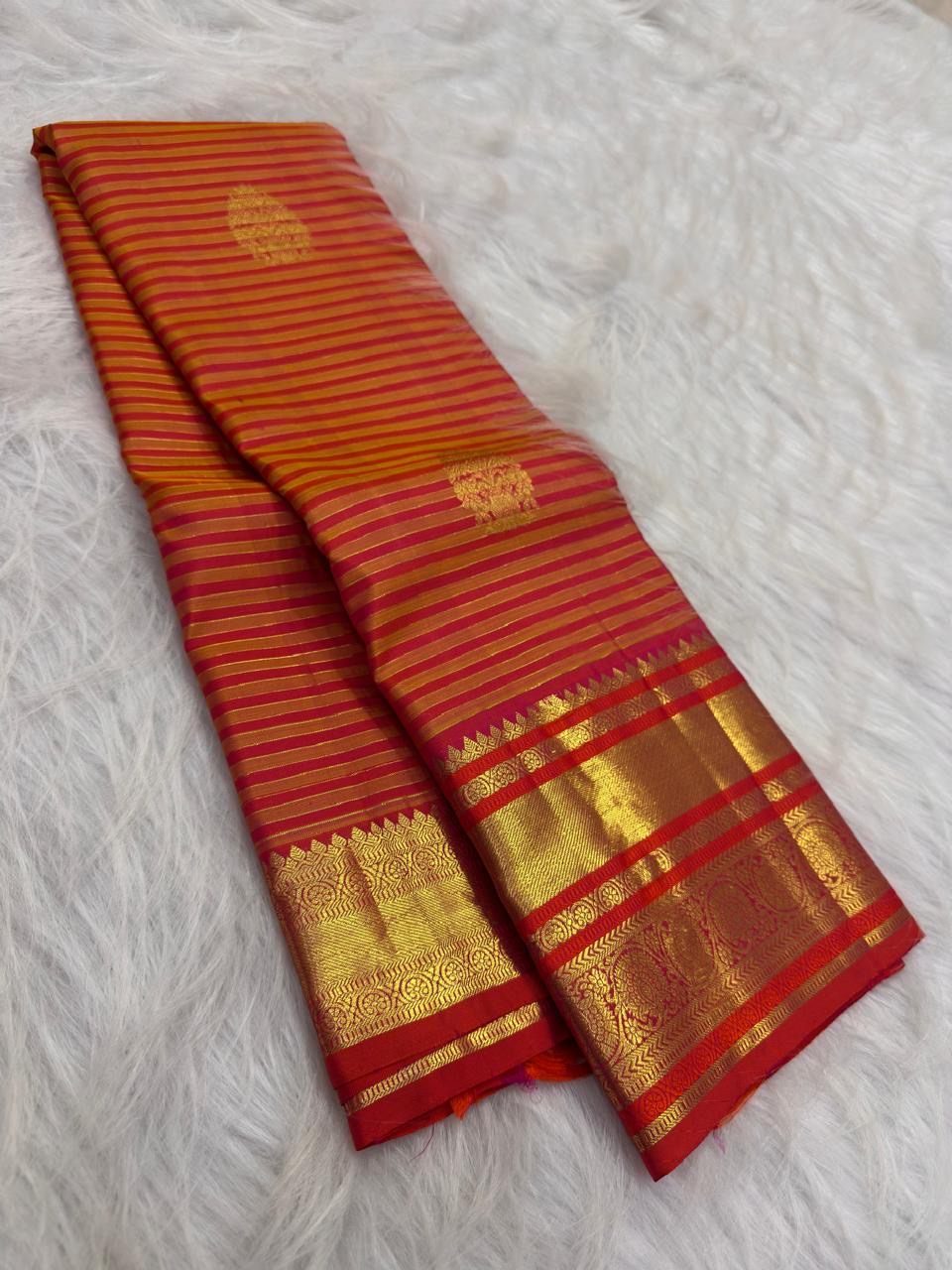 Displayed pallu of Vairaoosi saree showing richly woven zari lattice work and decorative Rudhraksham motifs.