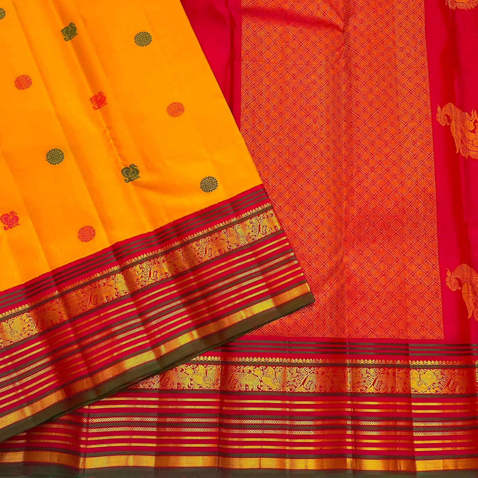 Golden turmeric Kanchipuram silk saree with colourful silk thread floral and elephant buttas.