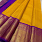 Golden Turmeric Yellow Kancheepuram Saree — royal-purple Korvai border with gold zari elephant motifs