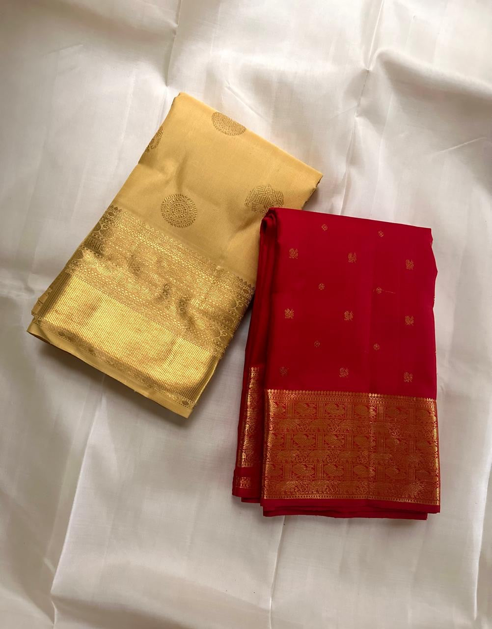 Full pallu view showing a dense geometric gold zari field and long ornamental registers