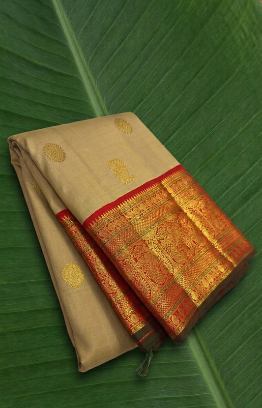Golden wheat beige Kanchipuram silk saree with sunset red korvai border folded display