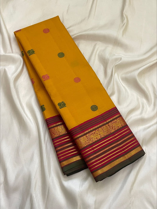 Golden turmeric Kanchipuram Butta saree with gold zari yaanai (elephant) motifs — Idam Living.