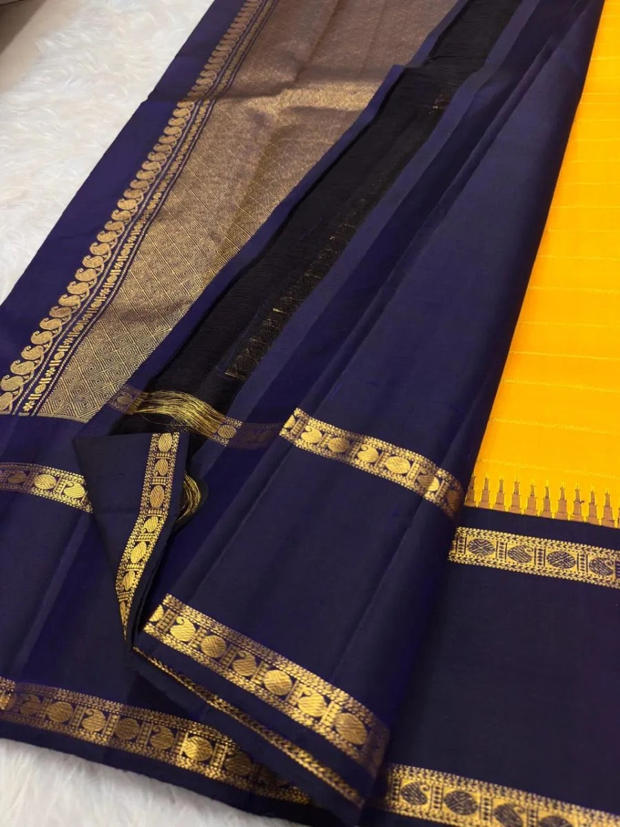 Golden Yellow Kanjeevaram saree with fine thanga-zari Veldhari lines