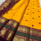 Golden yellow handwoven pure silk Kanjipuram saree with deep maroon Korvai border