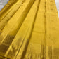 Folded Butter Yellow Varisaipet saree with woven gold buttas and ornate zari border