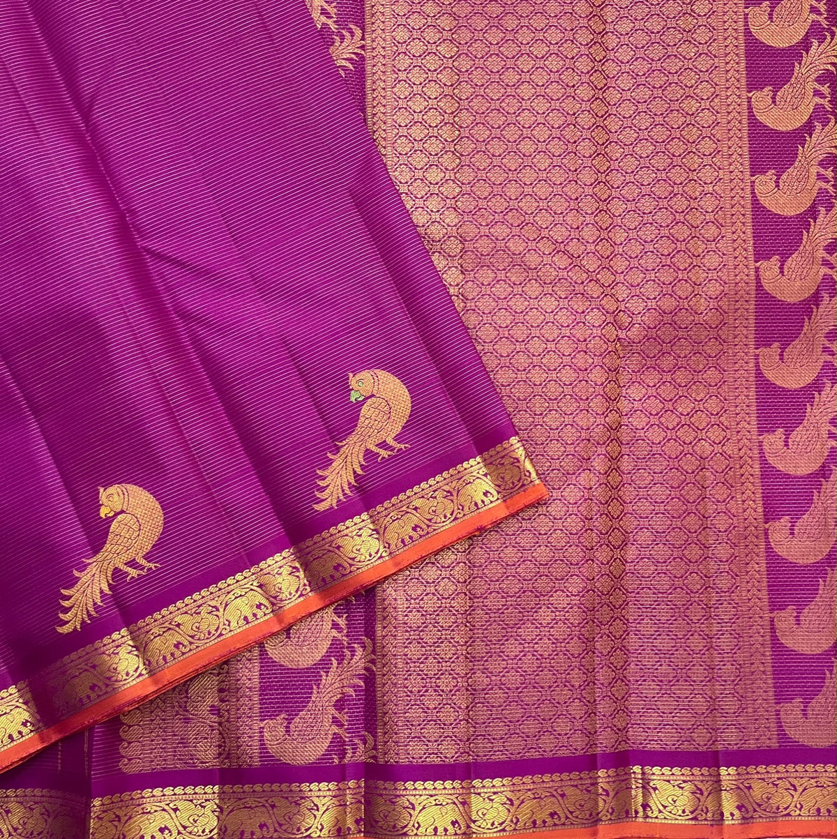 Handwoven Vadamalli purple pure silk Kanchipuram saree with gold Kili buttas and floral scroll zari band
