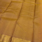 Sunset orange Kanchipuram silk saree, pallu with fine gold zari lattice and yellow-gold striping