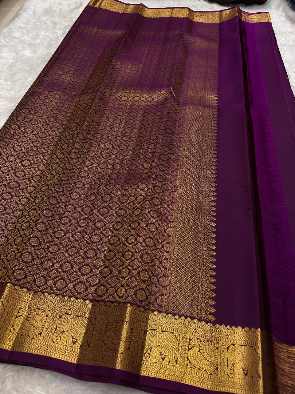 Handwoven pure silk Kanjeevaram saree in grape purple with Maanga paisley Mayil butta and ornate antique gold zari border Silk Mark certified