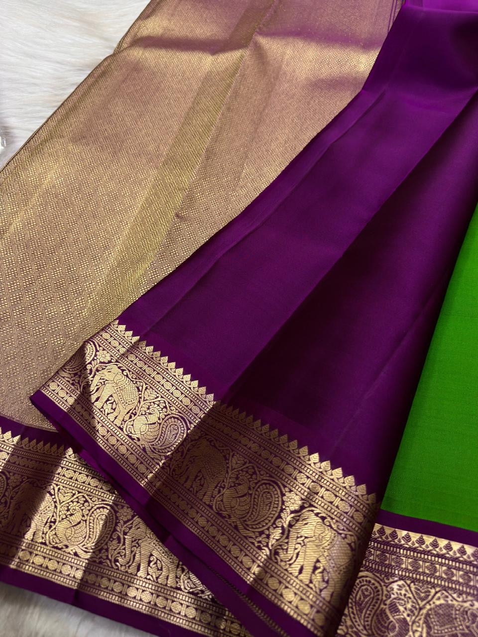 Ilai Pachai Green Kanjivaram body with traditional spaced antique-gold zari motifs.