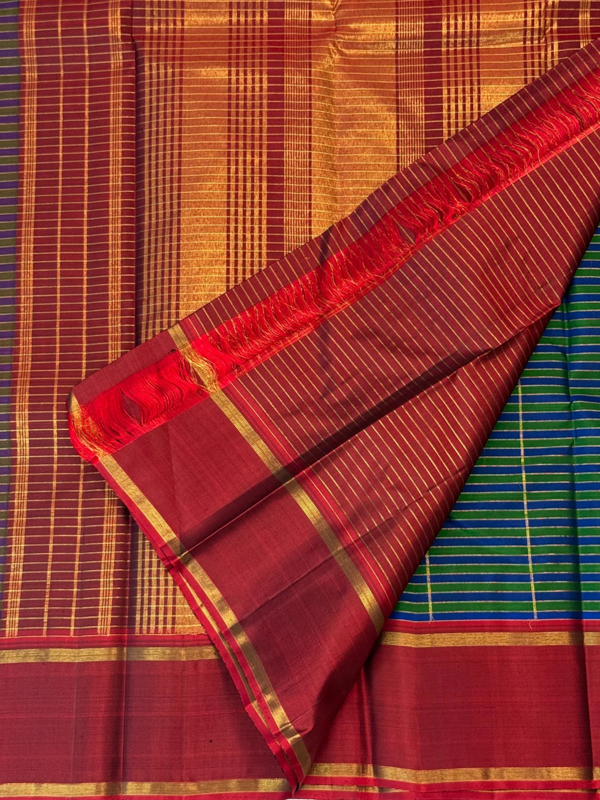Green and cobalt blue handwoven Pure Silk Kanjivaram Kanchi Kattam saree with gold grid lines and red Rettapet border, body weave detail
