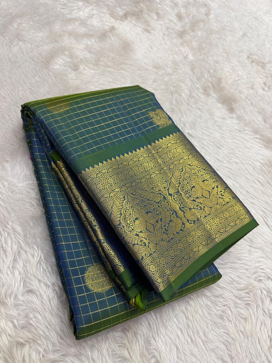 green blue shot kanchipuram silk saree with zari kattam and mayil chakram butta folded view