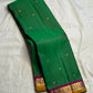 Green Butta Kancheepuram silk saree folded, showing full drape and border