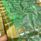 Circular gold and silver-toned motifs on green Chanderi saree