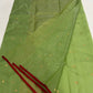 Green handloom Chanderi silk saree showing gold buttas and slender red silk border