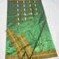 Close-up of gold zari border on green Chanderi saree