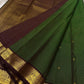 Pure Kanchipuram Silk Saree laid out with deep green checked body, maroon border, and contrasting pallu section visible in the frame.