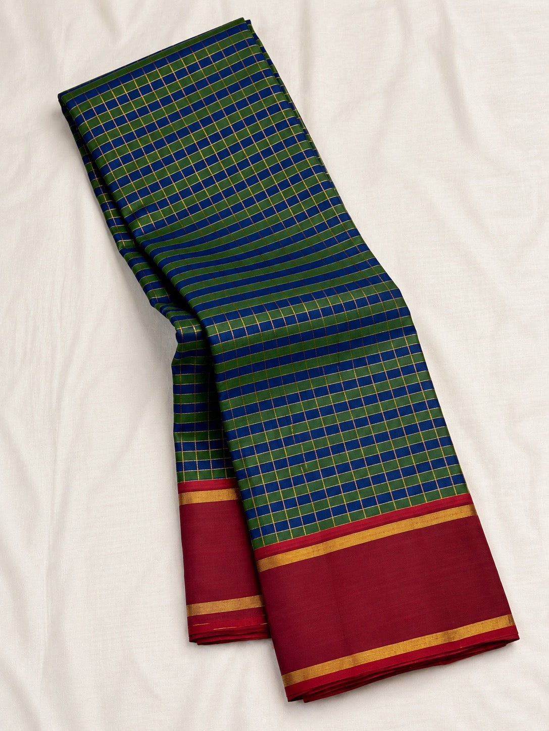 Green and cobalt blue handwoven Pure Silk Kanjivaram Kanchi Kattam saree with gold grid lines and red Rettapet border, border detail