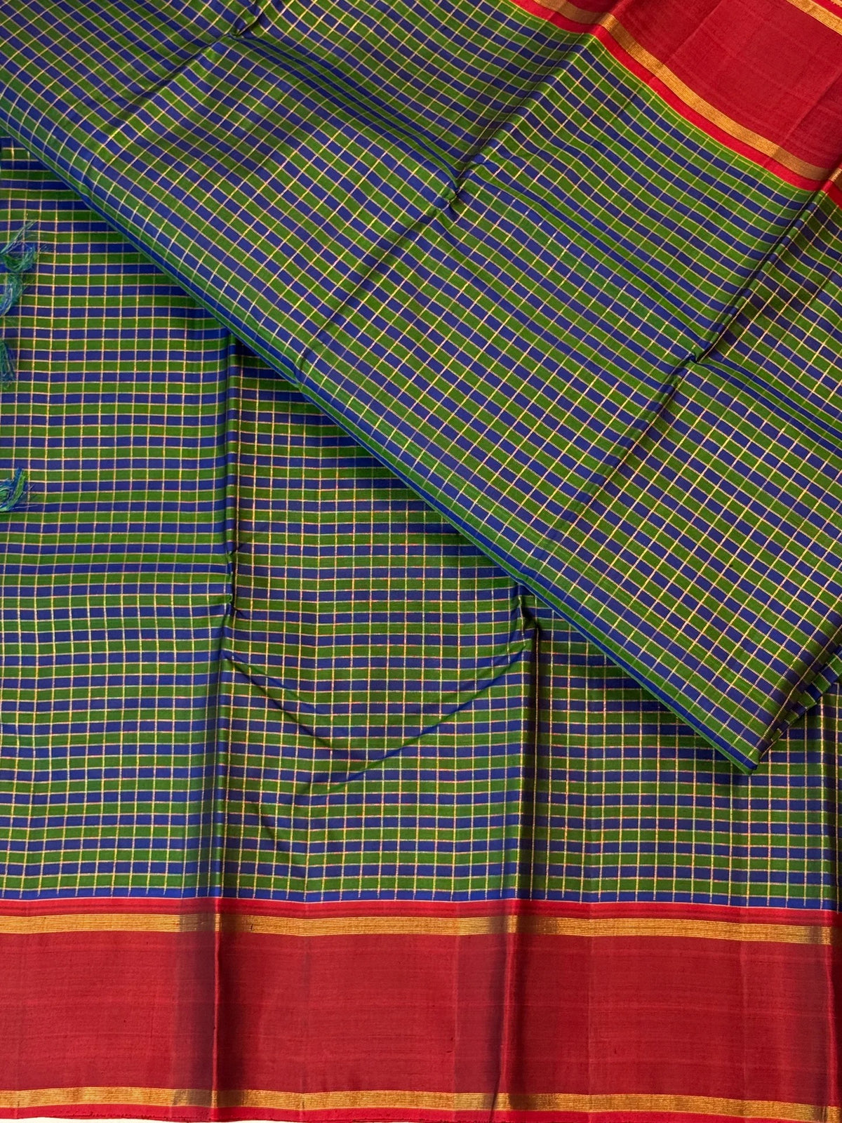 Green and cobalt blue handwoven Pure Silk Kanjivaram Kanchi Kattam saree with gold grid lines and red Rettapet border, pallu detail