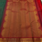 Deep Forest Green silk with gold and silver-toned zari buttas within the Kattam grid.