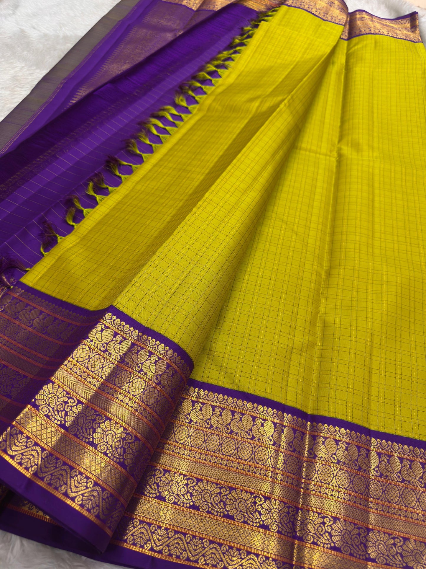 Traditional Kanchipuram silk saree showcasing Annapakshi motifs woven in antique gold zari