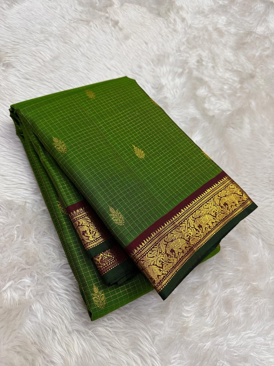 Handwoven green silk saree with antique gold woven kattam checks