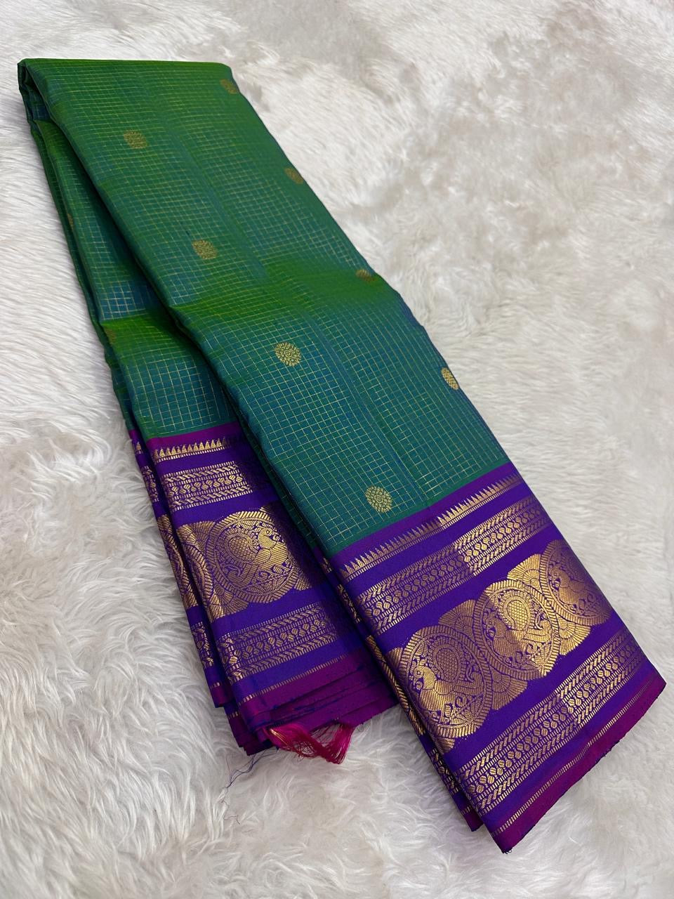 peacock green Kanchipuram silk saree with zk-yb weave folded view