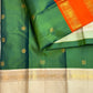 Double-shot leaf-to-emerald green with golden-mustard light pure silk Kanchipuram saree, orange ivory kanchipuram ganga jamuna; traditional Rettapet weave.