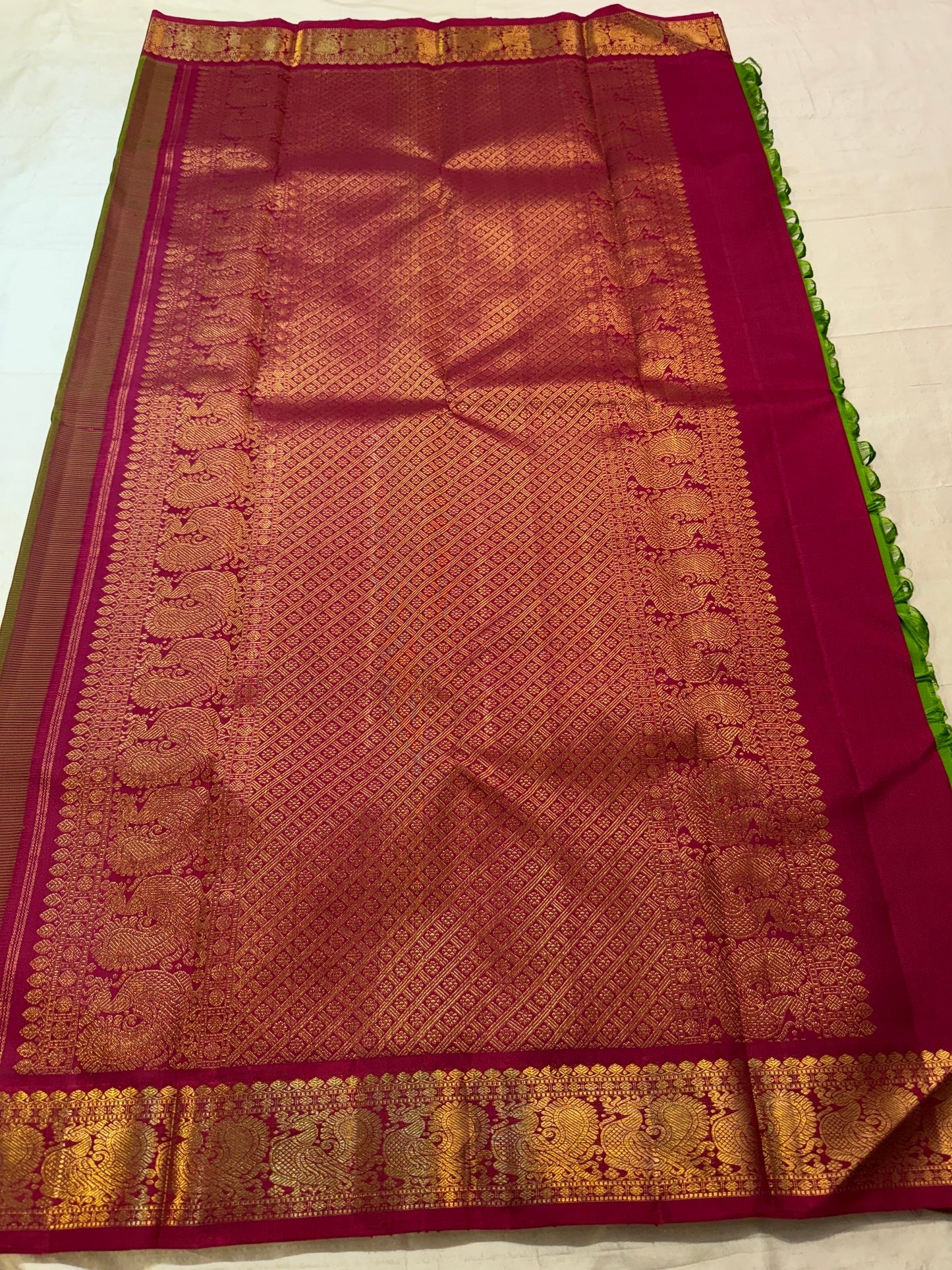 Pachai Green Kanjivaram saree with handwoven silk thread buttas detail