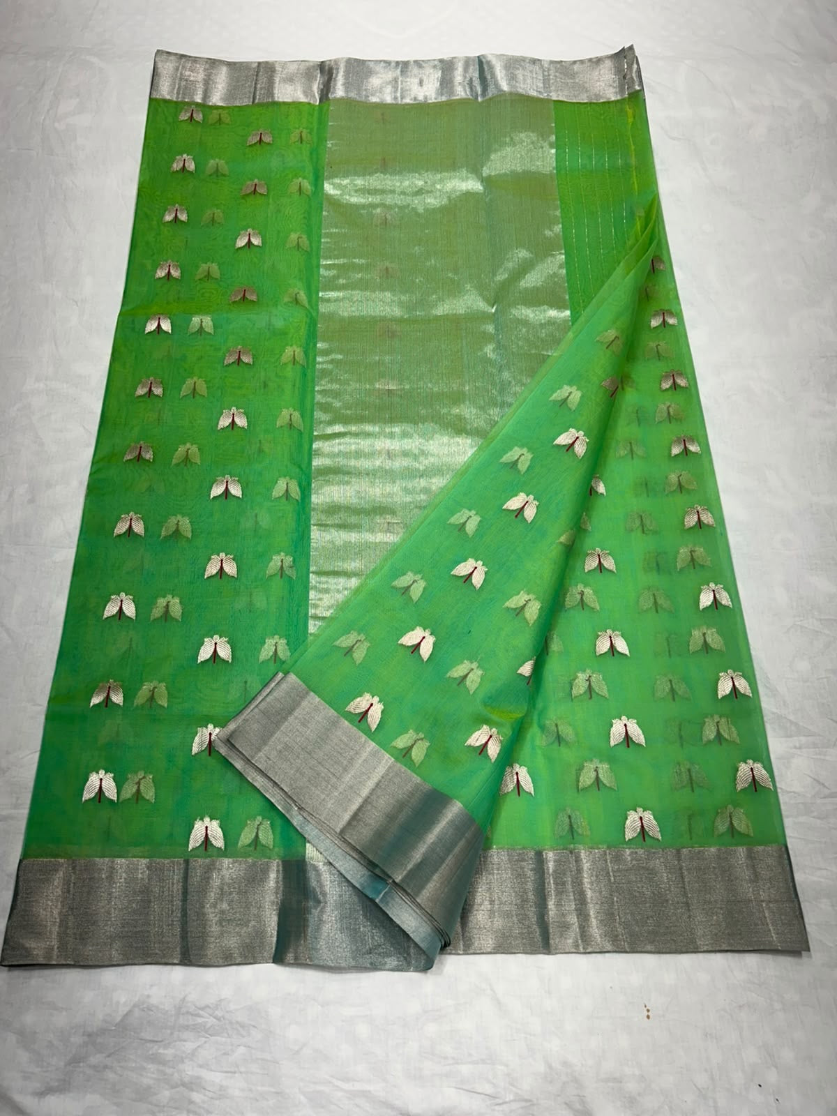 Silver-toned floral butta detail on green silk
