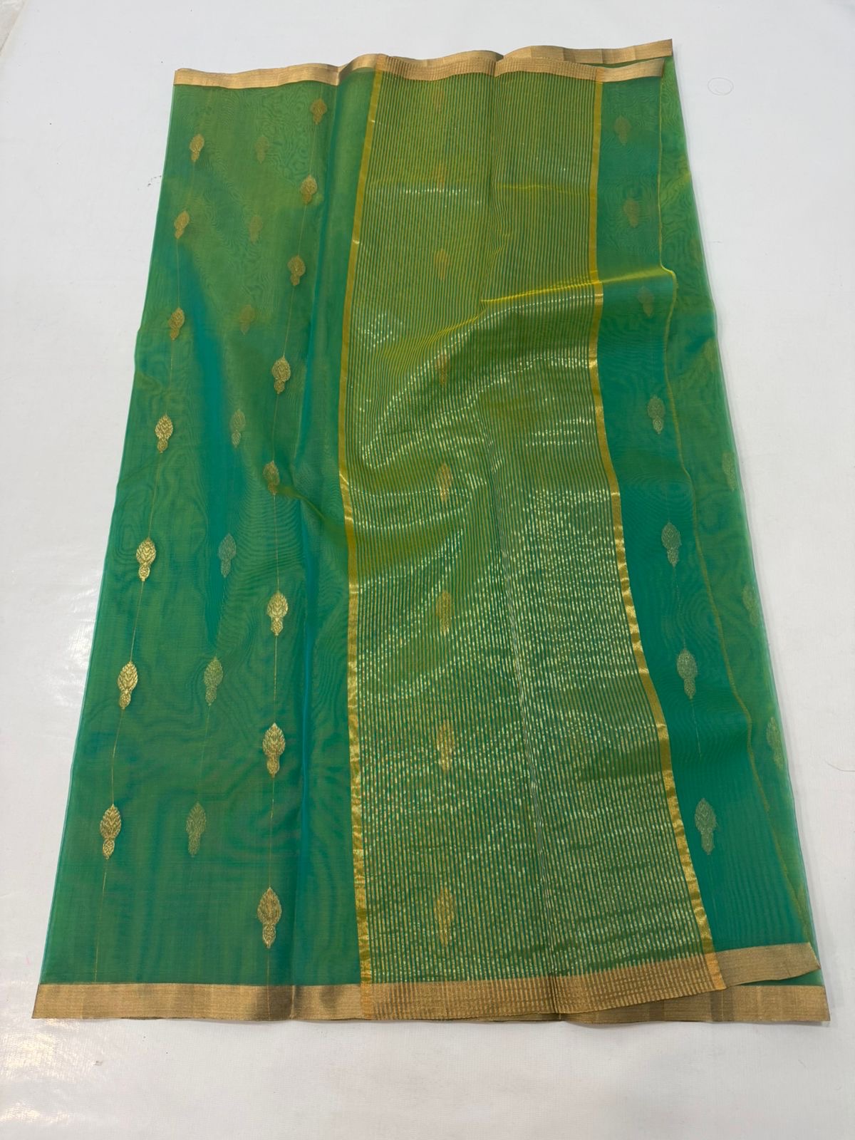 Full Sea Green handloom Chanderi saree with linear gold buttas and broad striped metallic pallu