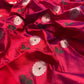 Detail of green leaf accents woven into the silver floral buttas on the Raspberry Red Chanderi saree