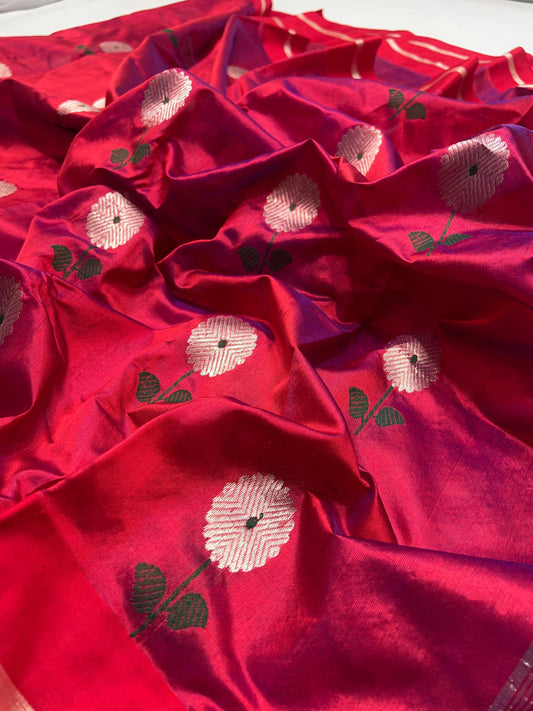 Detail of green leaf accents woven into the silver floral buttas on the Raspberry Red Chanderi saree