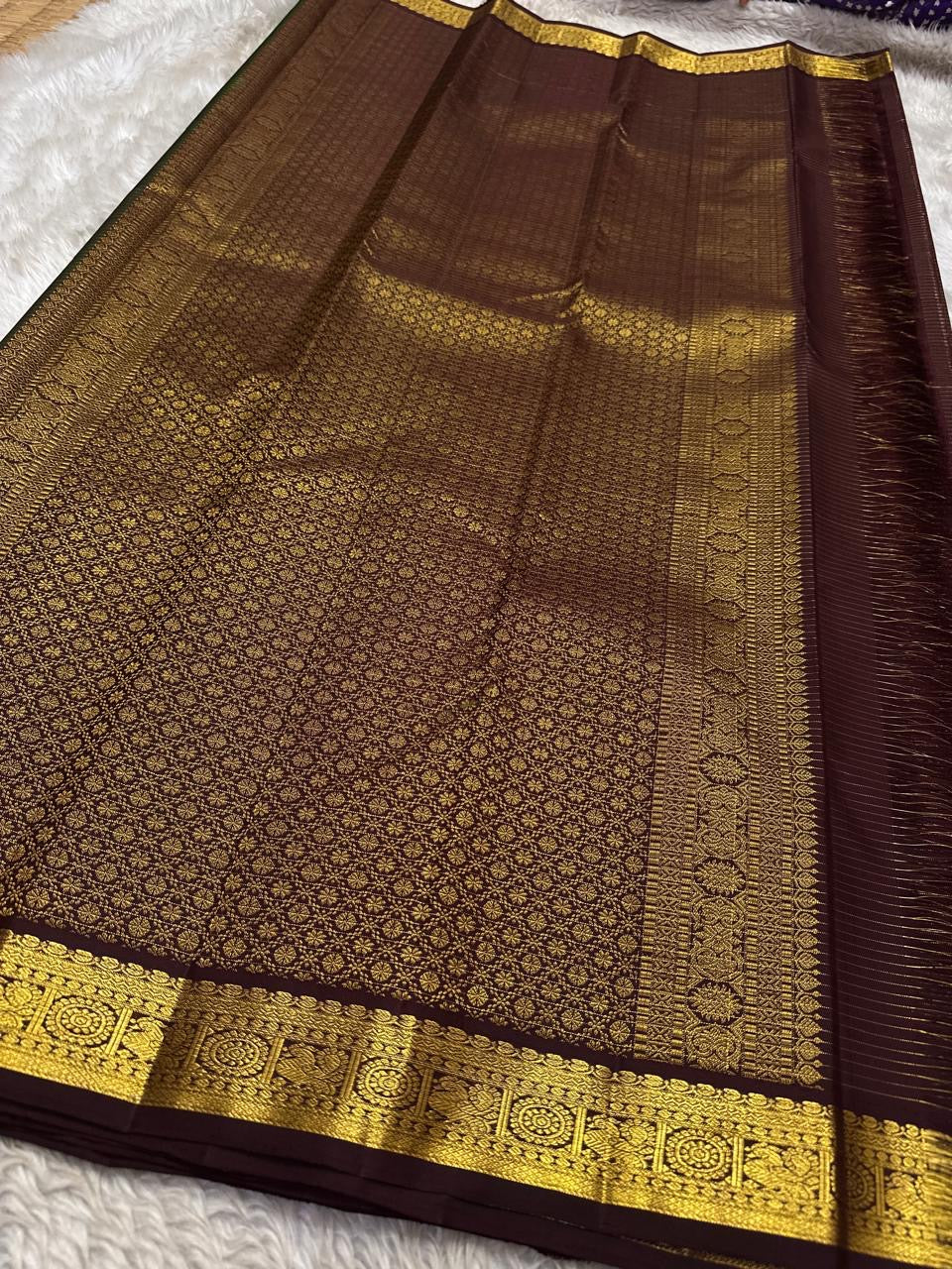 Wide view of maroon pallu on a Pure Kanchipuram Silk Saree with dense gold zari weaving and broad zari border, available in the USA.