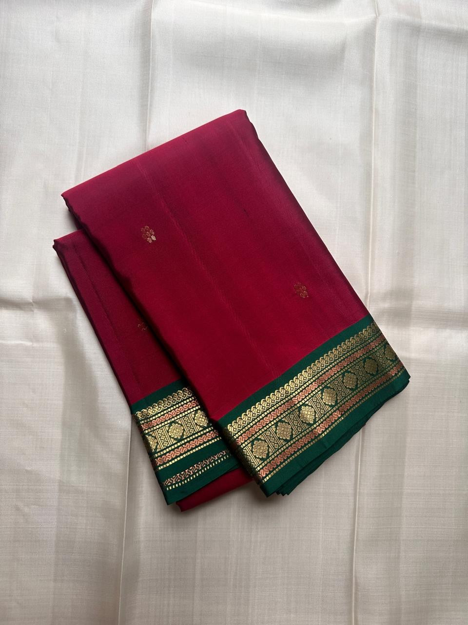 Pure Kanchipuram silk saree in deep green with narrow gold zari border shown in close view, shipped from New Jersey USA