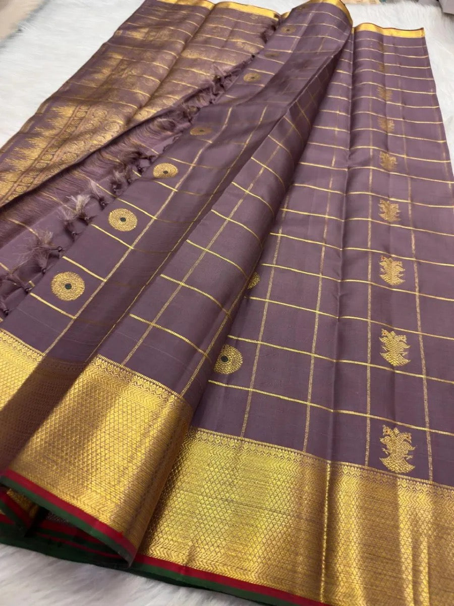Handwoven Zari Kattam Kanjivaram saree with fine gold checks and meenakari medallion motifs.