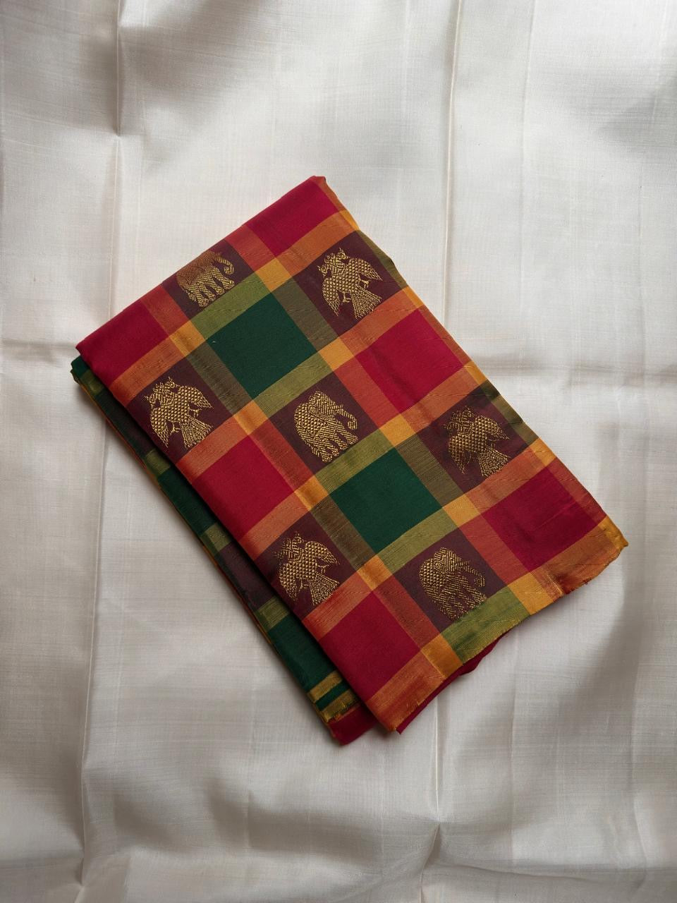 Emerald Green and Raspberry Pink Kanchi Kattam saree with antique gold zari buttas