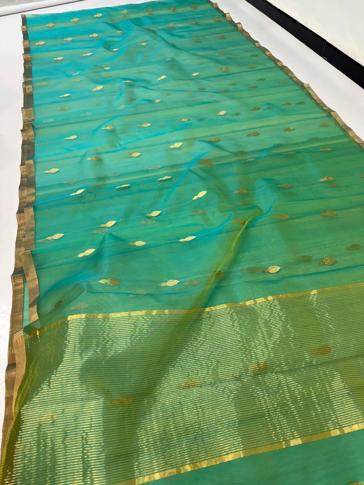 Sea Green Chanderi saree border detail showing the slim antique-gold woven edge