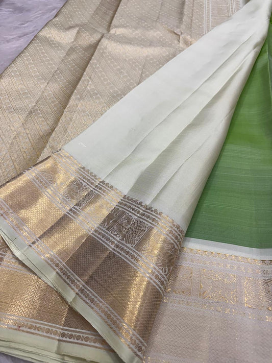 Fresh Leaf Green Pure Silk saree with scattered gold buttas and Warm Ivory Korvai border