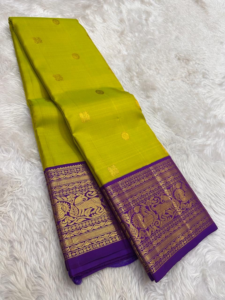 Green Pure Silk Kanchipuram saree with deep purple gold zari border