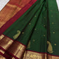 Pallu detail of the handwoven Kanchipuram saree: A richly patterned Arakku red pallu with dense gold zari and repeated geometric ornament.