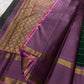 Handwoven green Kanchipuram silk with cool lavender border and richly geometric zari pallu.