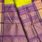 Tender leaf green and navy purple traditional Kanchipuram pure silk saree draped view