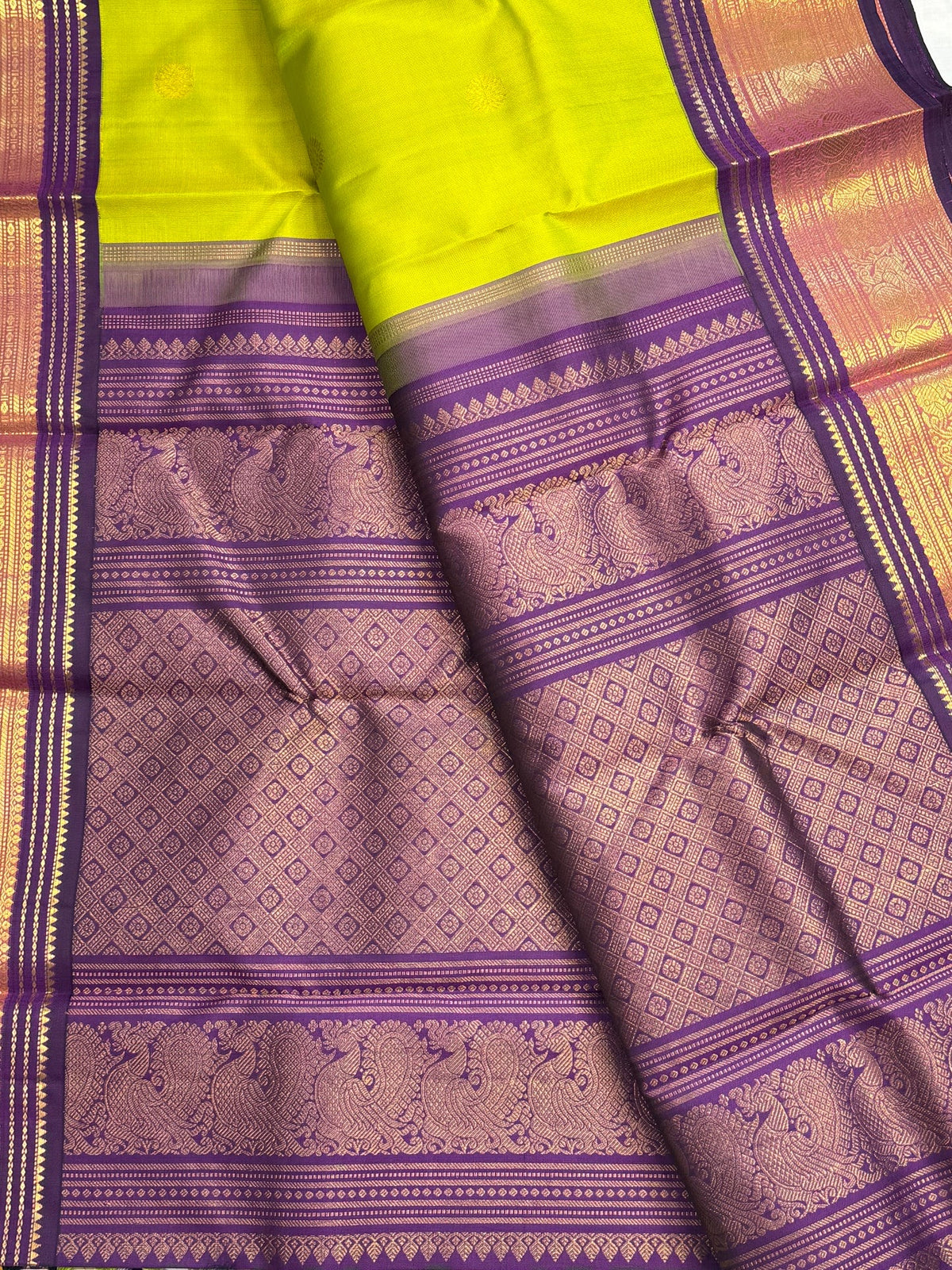 Tender leaf green and navy purple traditional Kanchipuram pure silk saree draped view