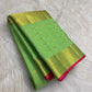 Green pure mulberry silk Varisaipet saree with fine gold zari lines and Rani Pink selvedge.