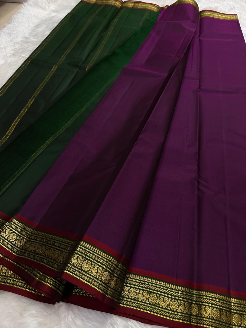 Folded purple end of pure Kanchipuram silk saree showing smooth silk surface and petite antique gold zari border