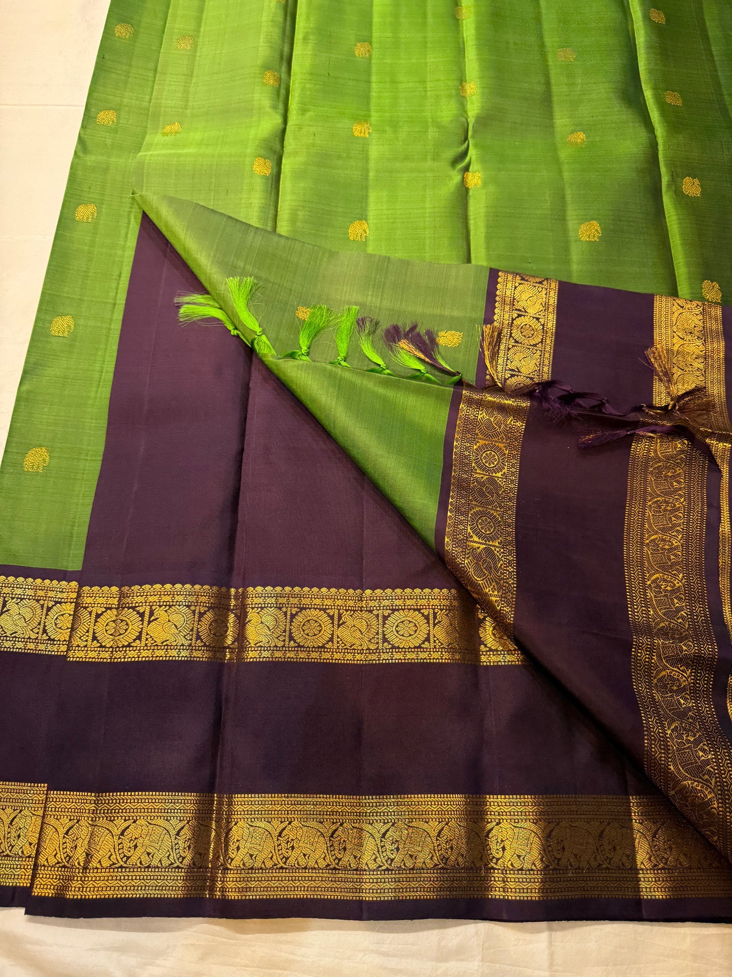 Gold zari woven pallu panel with purple border and ornate woven detailing on Pure Kanchipuram silk saree