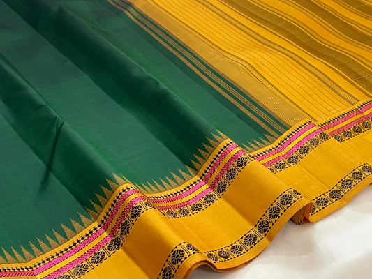Folded view of green and yellow Kanjivaram Pattupet saree with Pillayar Reku border — Idam Living