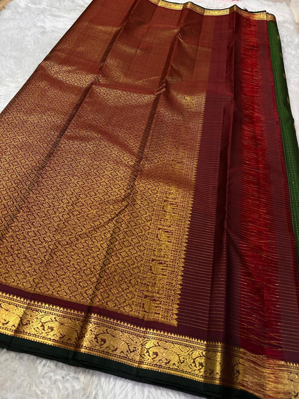 Full maroon pallu with dense gold zari woven pattern and ornate border, shipped from New Jersey USA
